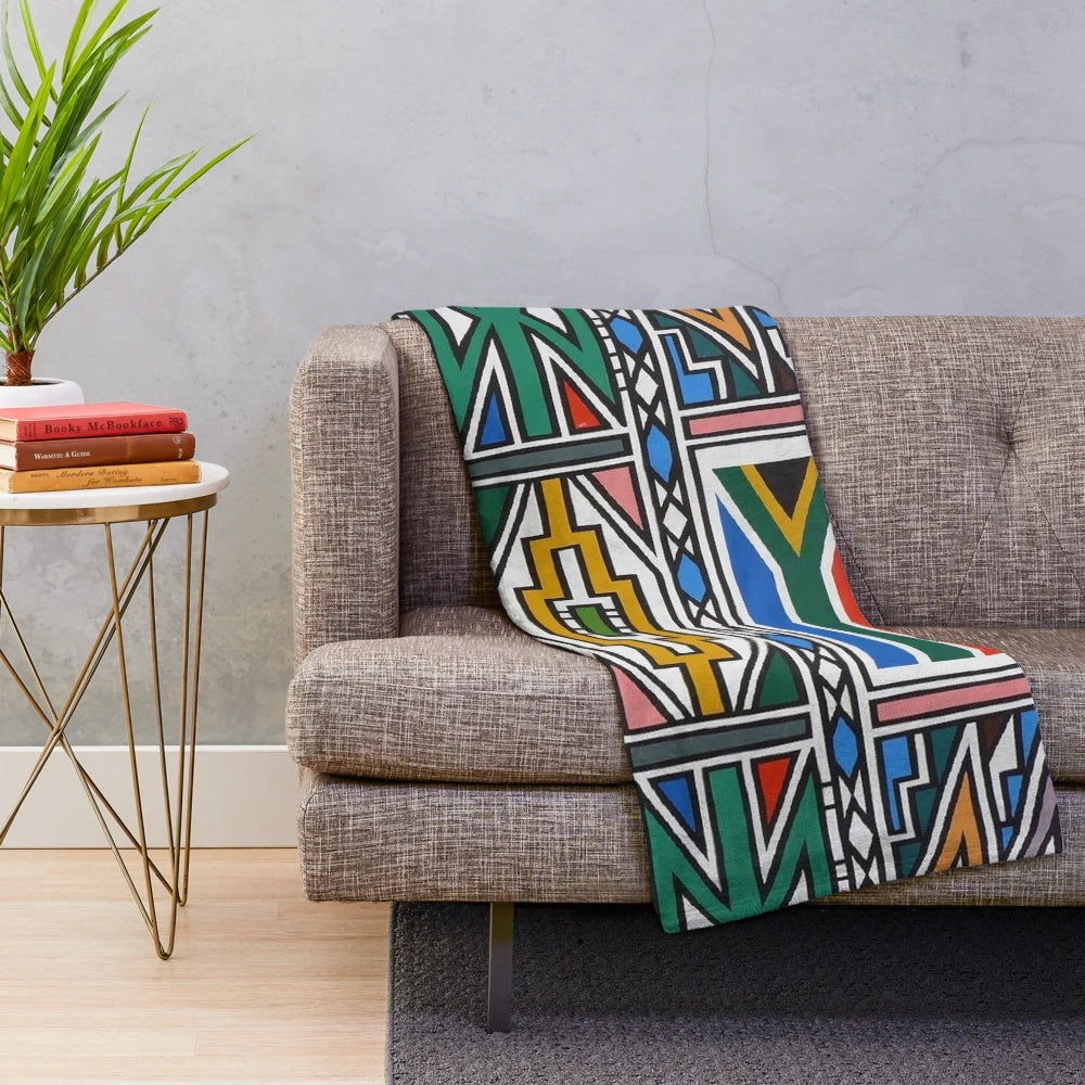 Ndebele-inspired plush blanket with vibrant tribal design