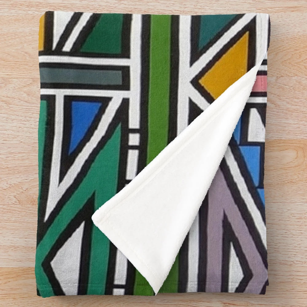 Ndebele-inspired plush blanket with vibrant tribal design