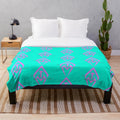 Neon pink and aqua plush blanket featuring the After the Mourning band logo