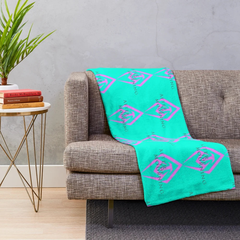 Neon pink and aqua plush blanket featuring the After the Mourning band logo