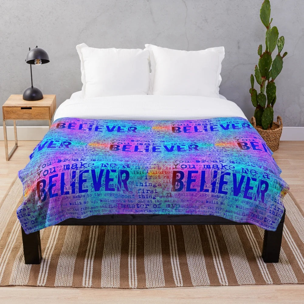 Neon rainbow-colored plush blanket with inspirational Imagine Dragons lyrics