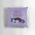 A neon-colored pillow featuring a cute, sleepy cat design for promoting mental wellness and self-acceptance.