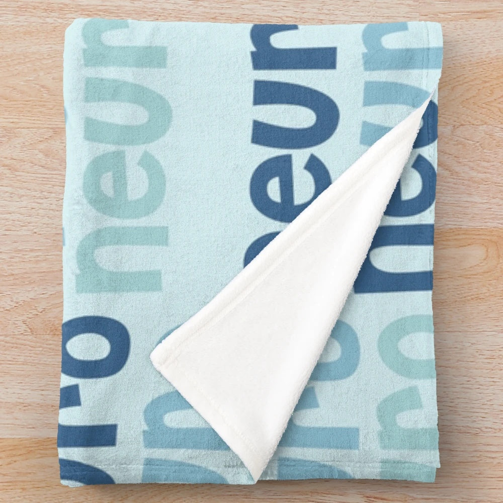 Neuroscience-inspired blue and floral plush blanket for occupational therapy professionals