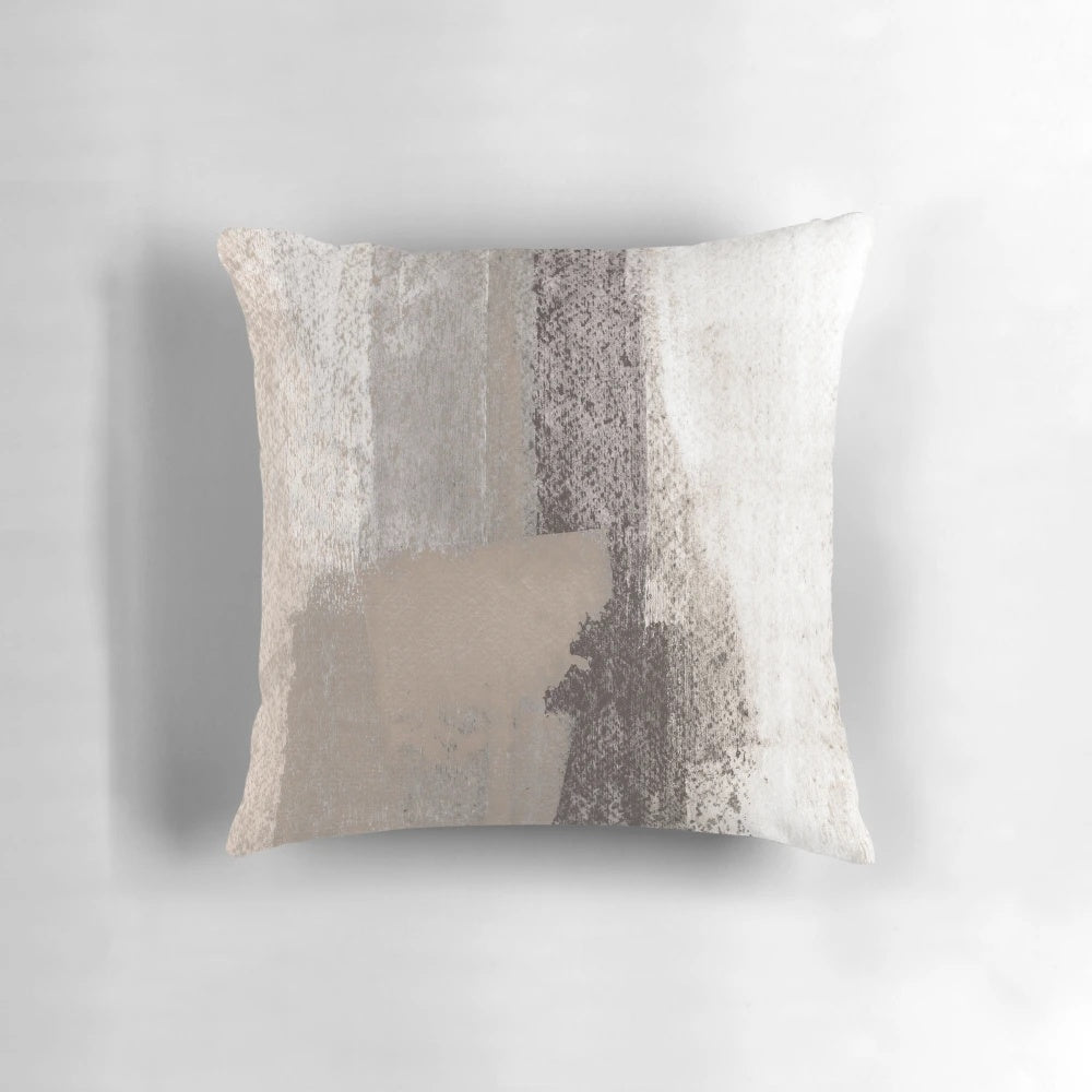 Taupe and charcoal grey abstract painting on a decorative throw pillow