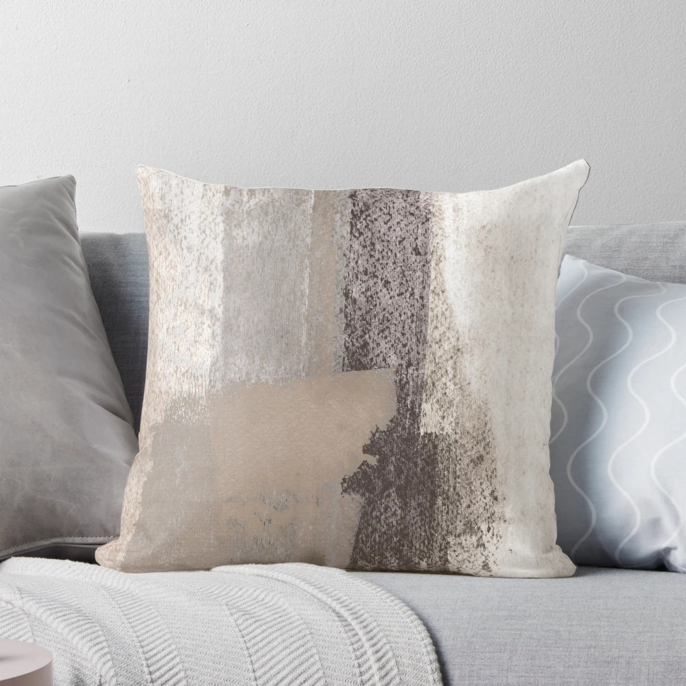 Taupe and charcoal grey abstract painting on a decorative throw pillow