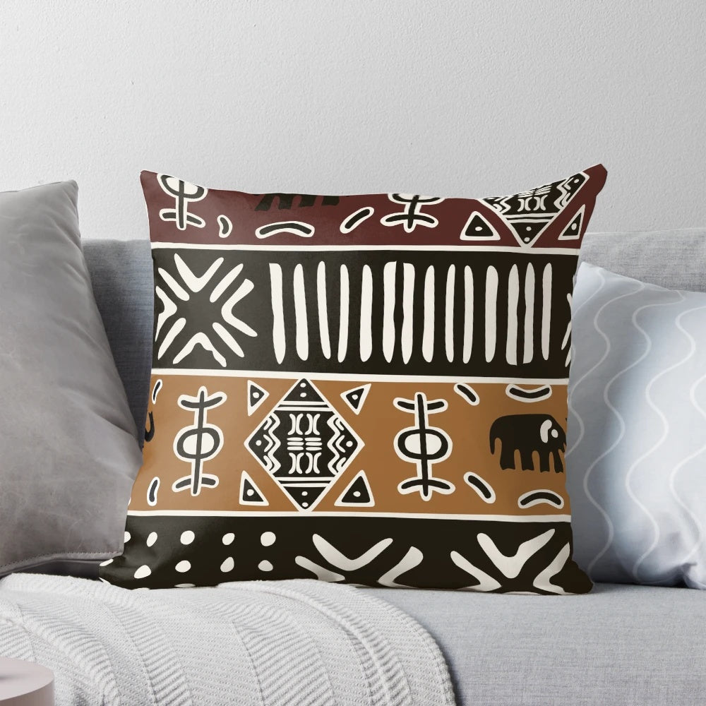 Neutral-toned pillow with a tribal African-inspired elephant pattern