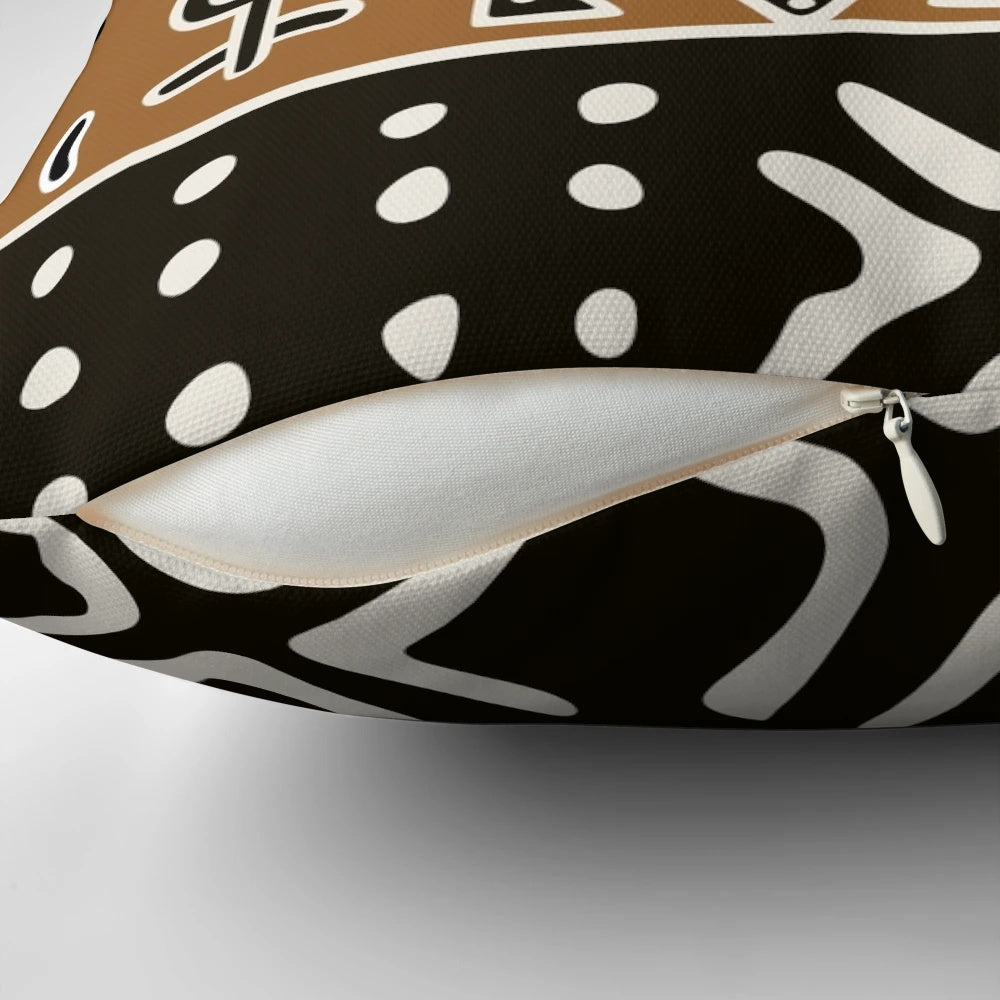 Neutral-toned pillow with a tribal African-inspired elephant pattern
