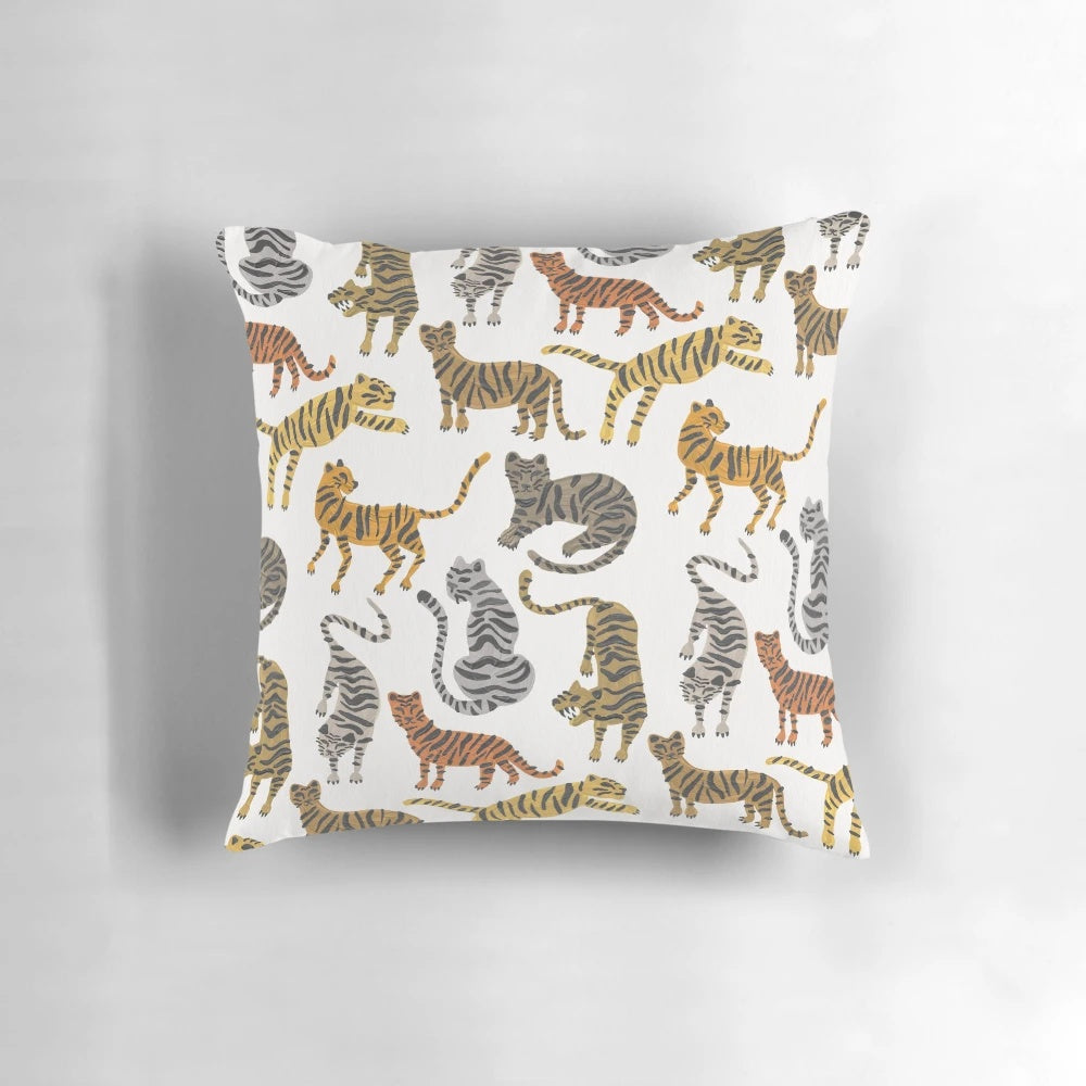 A neutral-toned pillow featuring a vibrant tiger design, perfect for jungle and safari-inspired home decor.
