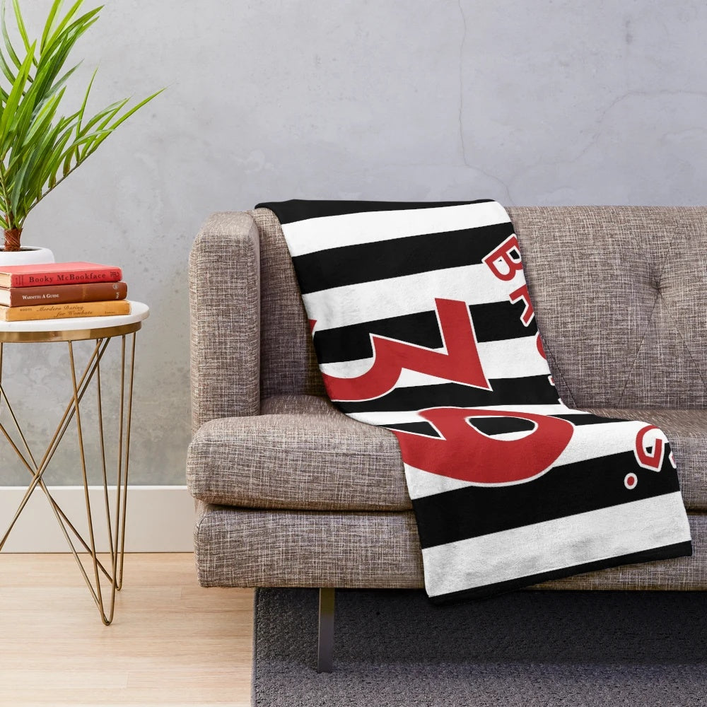 Newcastle United inspired plush blanket featuring midfielder Bruno Guimarães