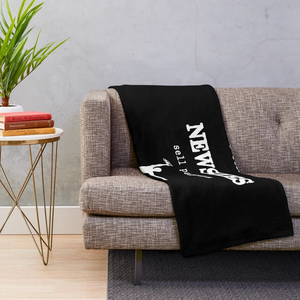 Newsies-inspired plush blanket with musical and theater-themed graphics