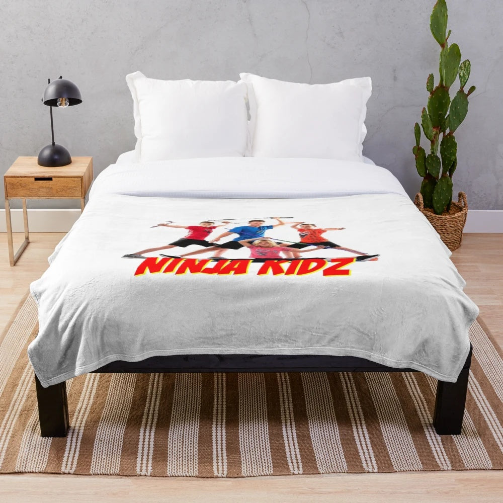 Ninja-inspired plush blanket with Ninja Kidz characters
