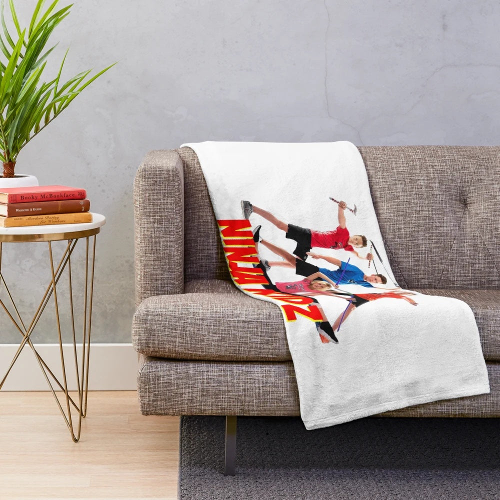 Ninja-inspired plush blanket with Ninja Kidz characters