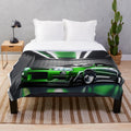 Nissan Skyline GTR 34 inspired plush throw blanket featuring a green sports car in a garage setting