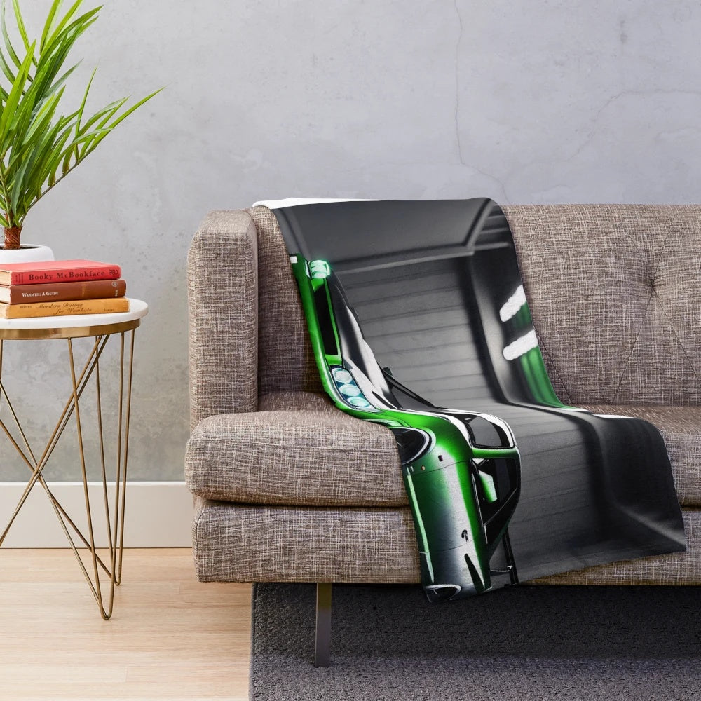 Nissan Skyline GTR 34 inspired plush throw blanket featuring a green sports car in a garage setting