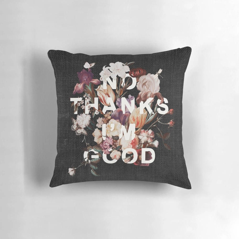 A "No Thanks I'm Good" message printed on a modern, minimalist pillow with a floral, botanical collage design.