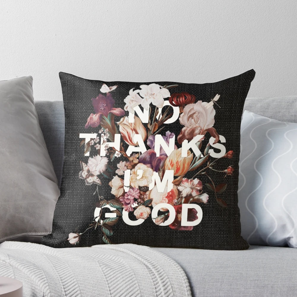 A "No Thanks I'm Good" message printed on a modern, minimalist pillow with a floral, botanical collage design.