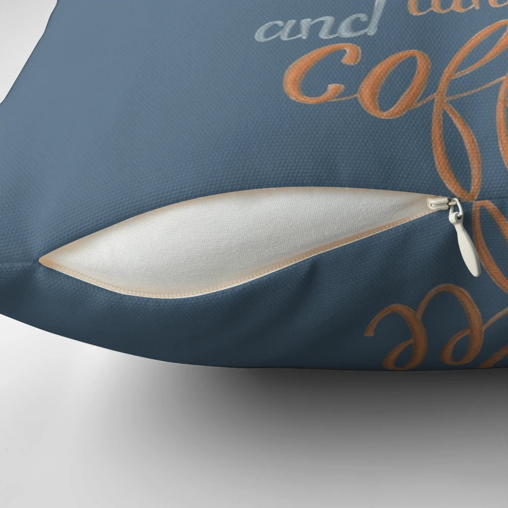 Pillow featuring a nocturnal orange moth resting on a cup of coffee against a dark background with handlettered typography.