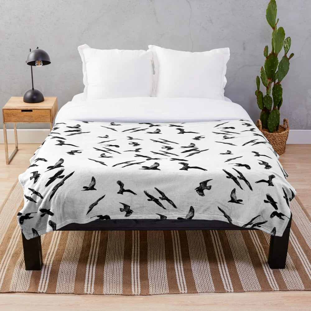 Cozy black and white plush blanket with bird imagery, perfect for Hitchcock fans