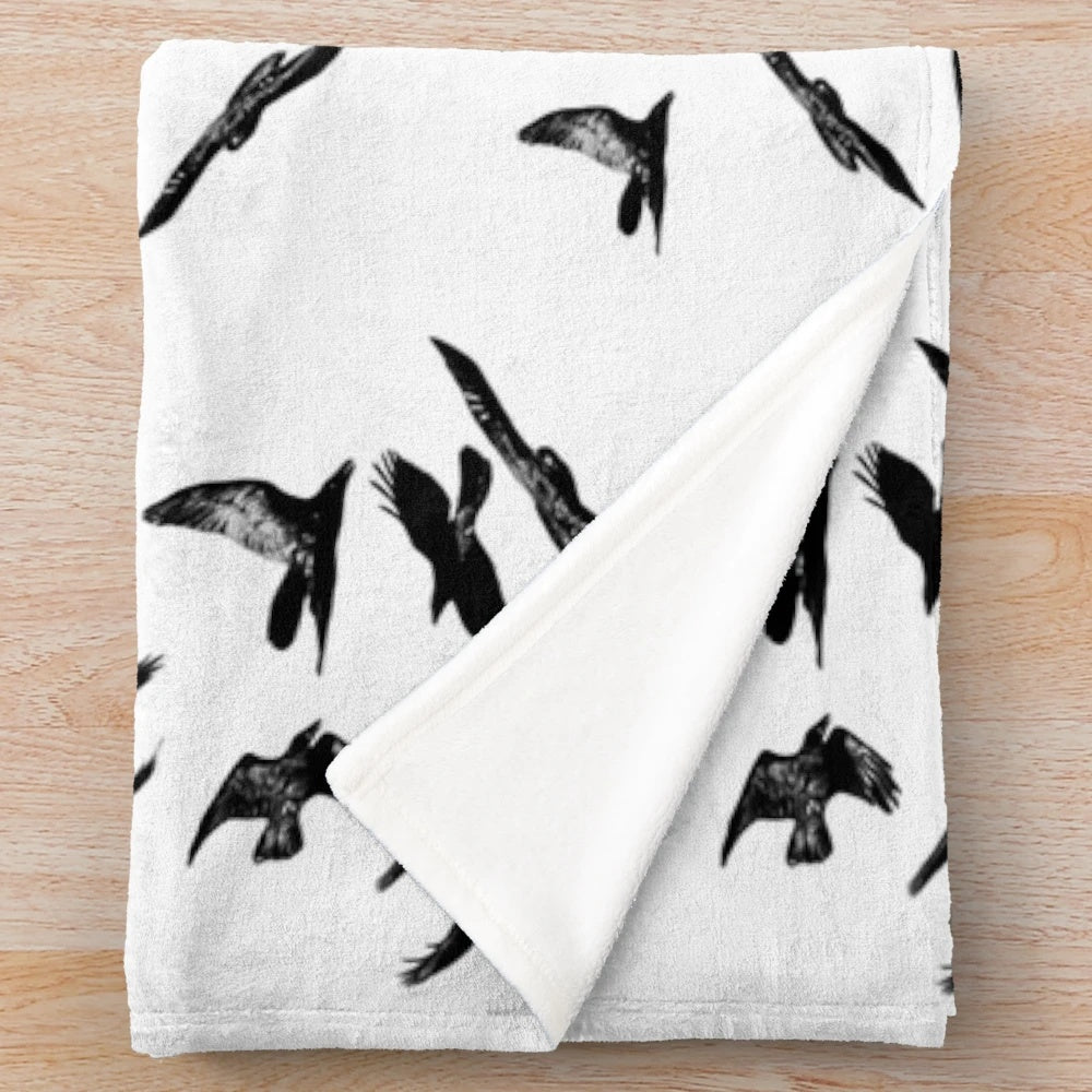 Cozy black and white plush blanket with bird imagery, perfect for Hitchcock fans