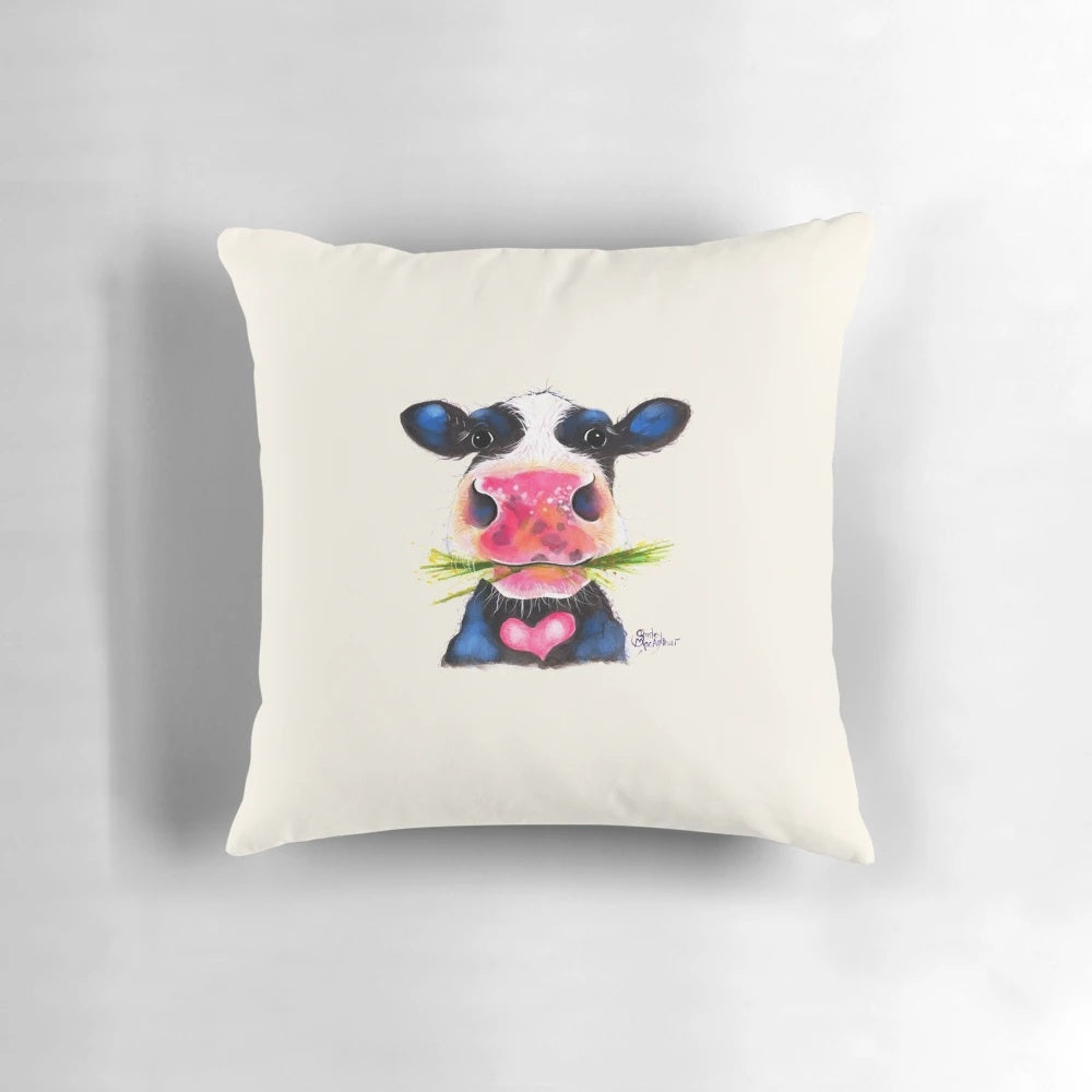 Nosey cow print pillow featuring a cheeky, large cow with horns in a herd design.