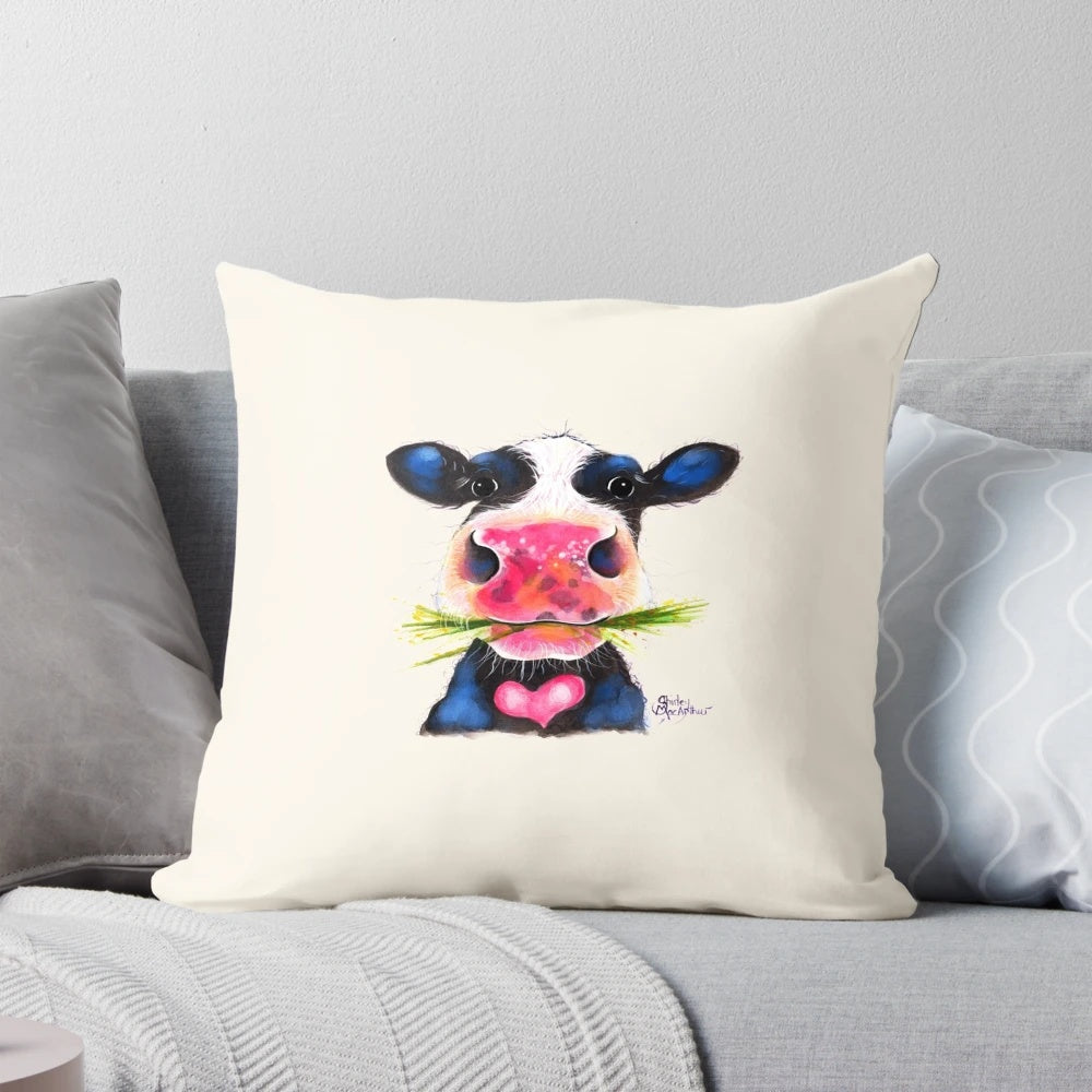 Nosey cow print pillow featuring a cheeky, large cow with horns in a herd design.