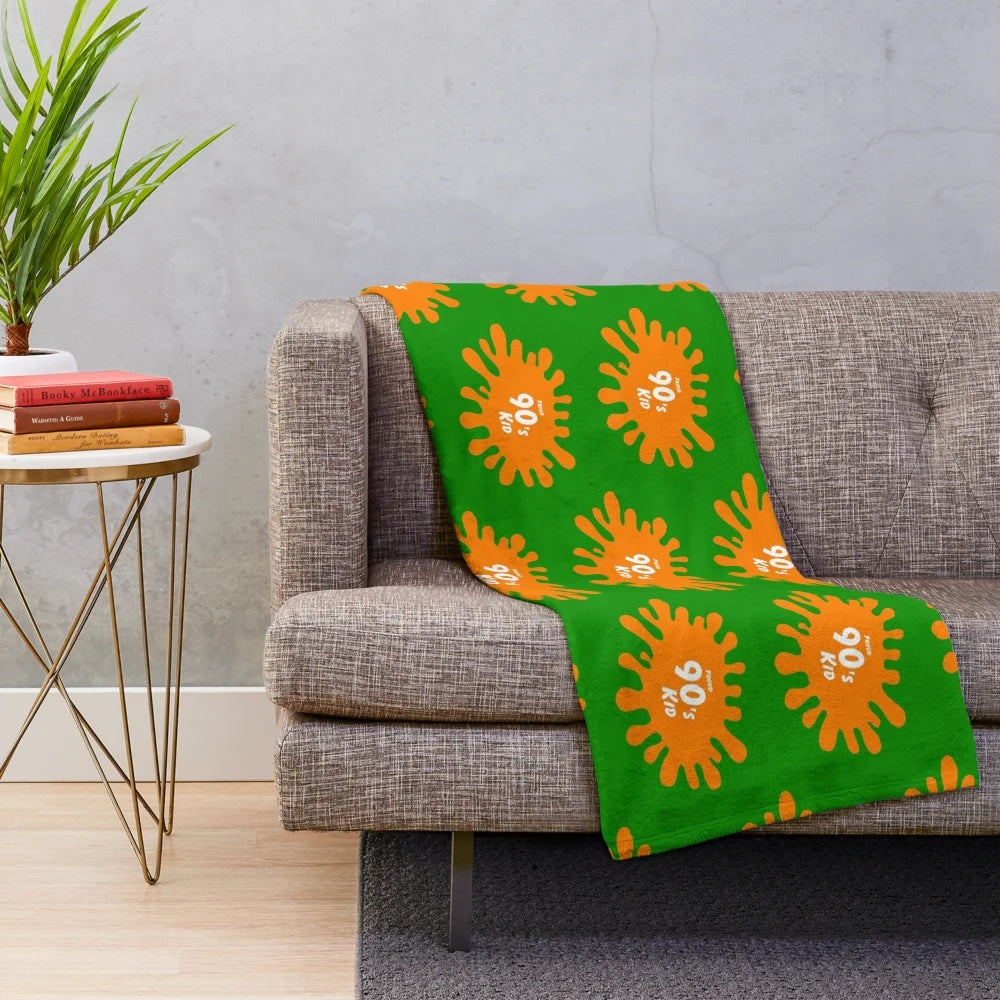 Nostalgic 90s retro TV plush blanket featuring iconic pop culture elements