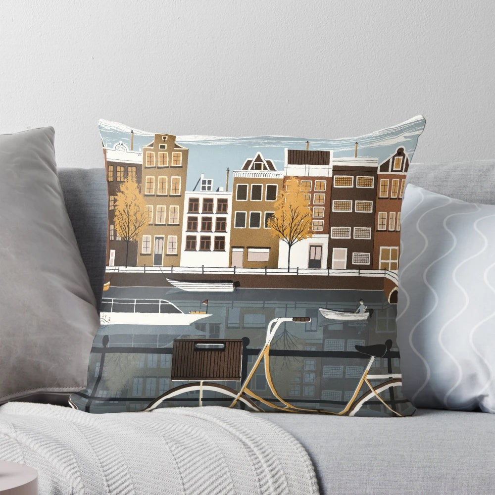 Vintage-inspired Amsterdam pillow featuring a scenic canal, bicycles, and historic architecture