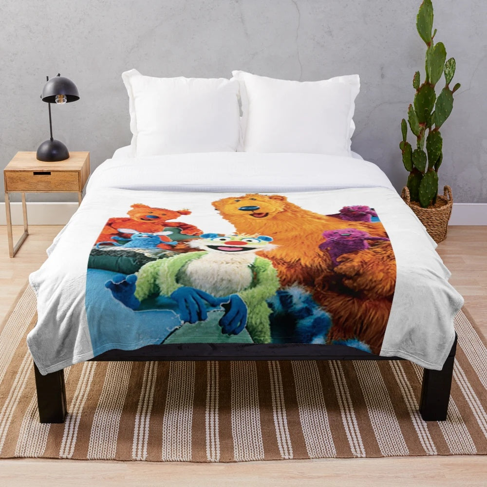 Cozy plush blanket featuring the characters from the beloved children's TV show 'Bear in the Big Blue House