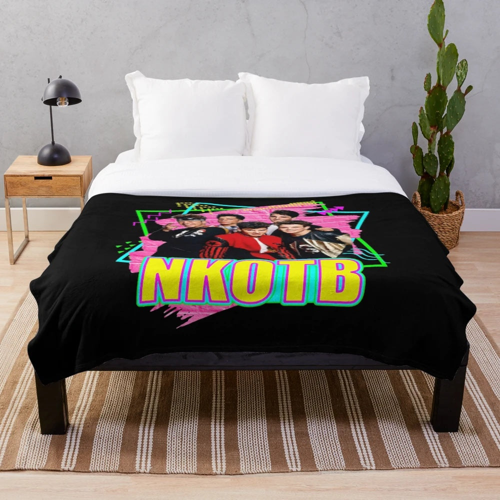 Plush blanket featuring the iconic New Kids on the Block band logo