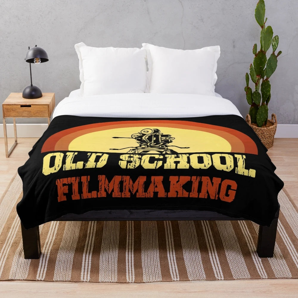 Cozy plush blanket featuring a vintage film camera and old school filmmaking theme