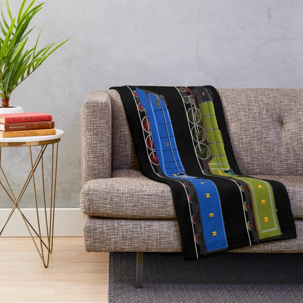 Plush blanket with illustrations of the Flying Scotsman and Mallard steam locomotives