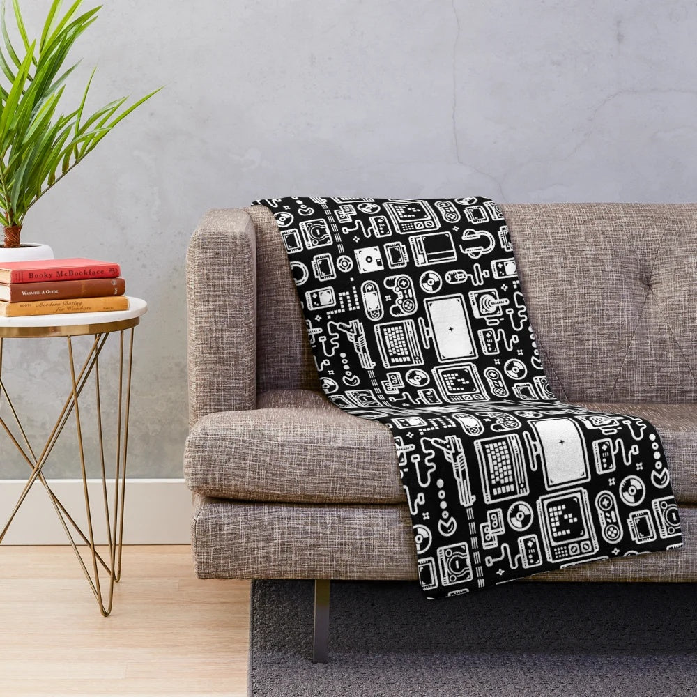 Retro gaming plush blanket featuring vintage video game consoles, controllers, and accessories