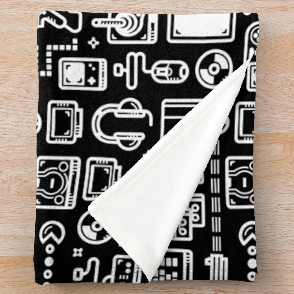Retro gaming plush blanket featuring vintage video game consoles, controllers, and accessories