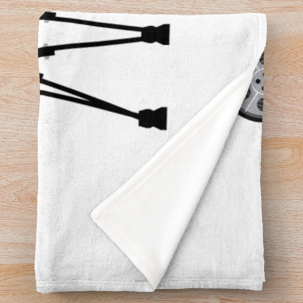 Cozy plush blanket featuring a vintage camera design
