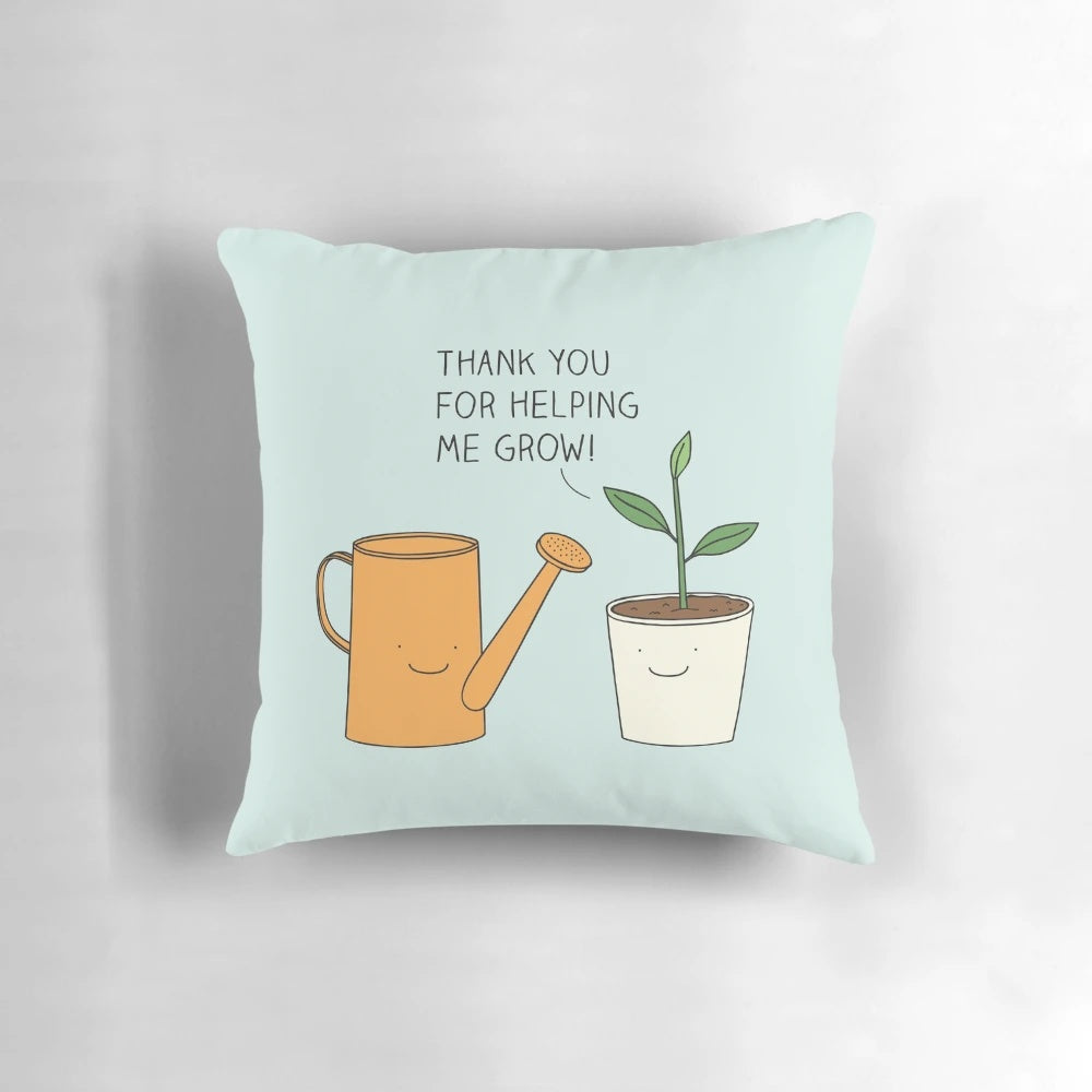 A decorative pillow with the text "Thank you for helping me grow!" and an illustration of a potted plant.
