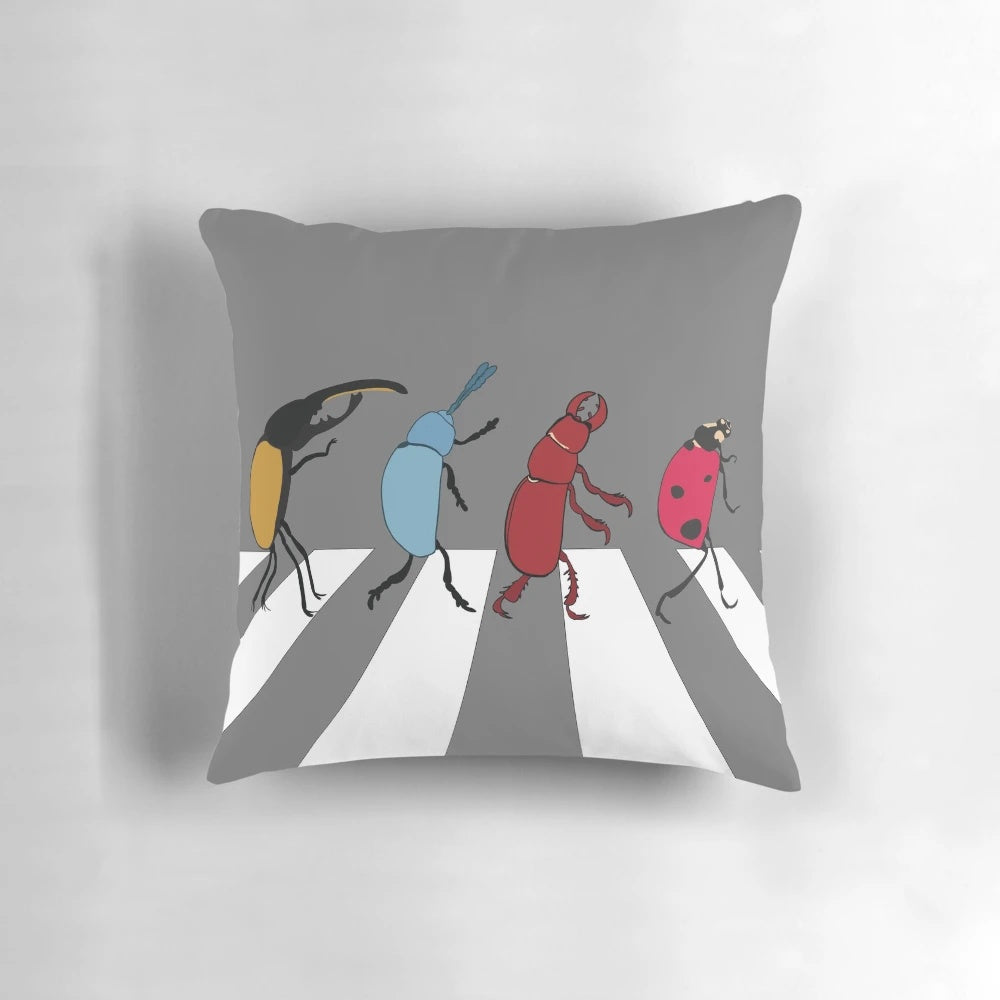 A novelty pillow designed to mimic the look of the Beatles, featuring the text "The Beetles" and a humorous design.