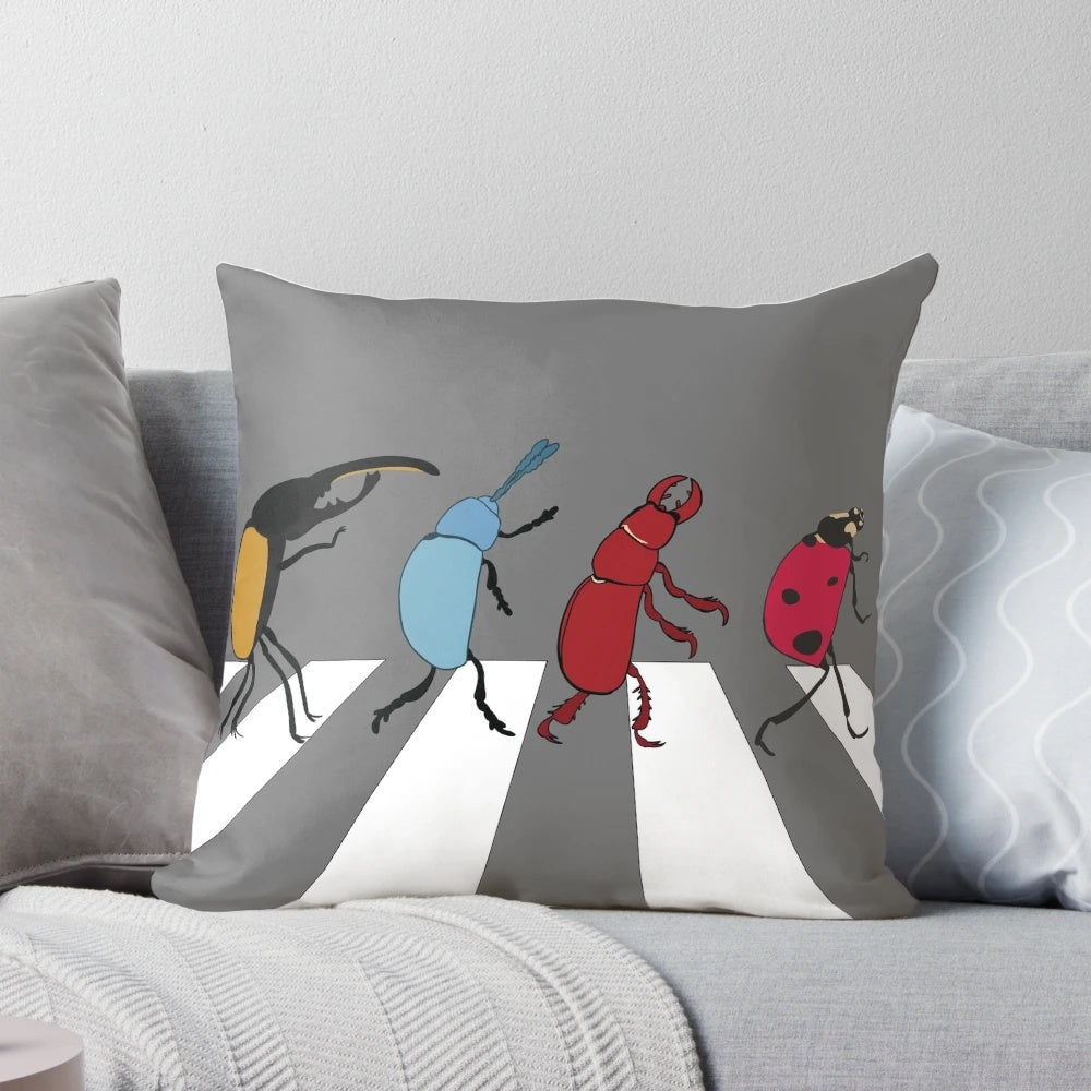 A novelty pillow designed to mimic the look of the Beatles, featuring the text "The Beetles" and a humorous design.
