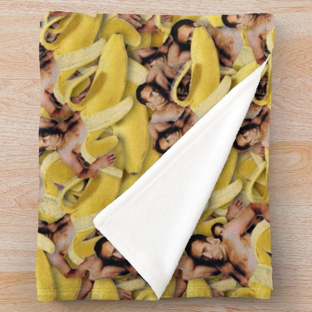 Cozy plush blanket featuring a collage of Nicolas Cage's iconic face in a banana pattern.