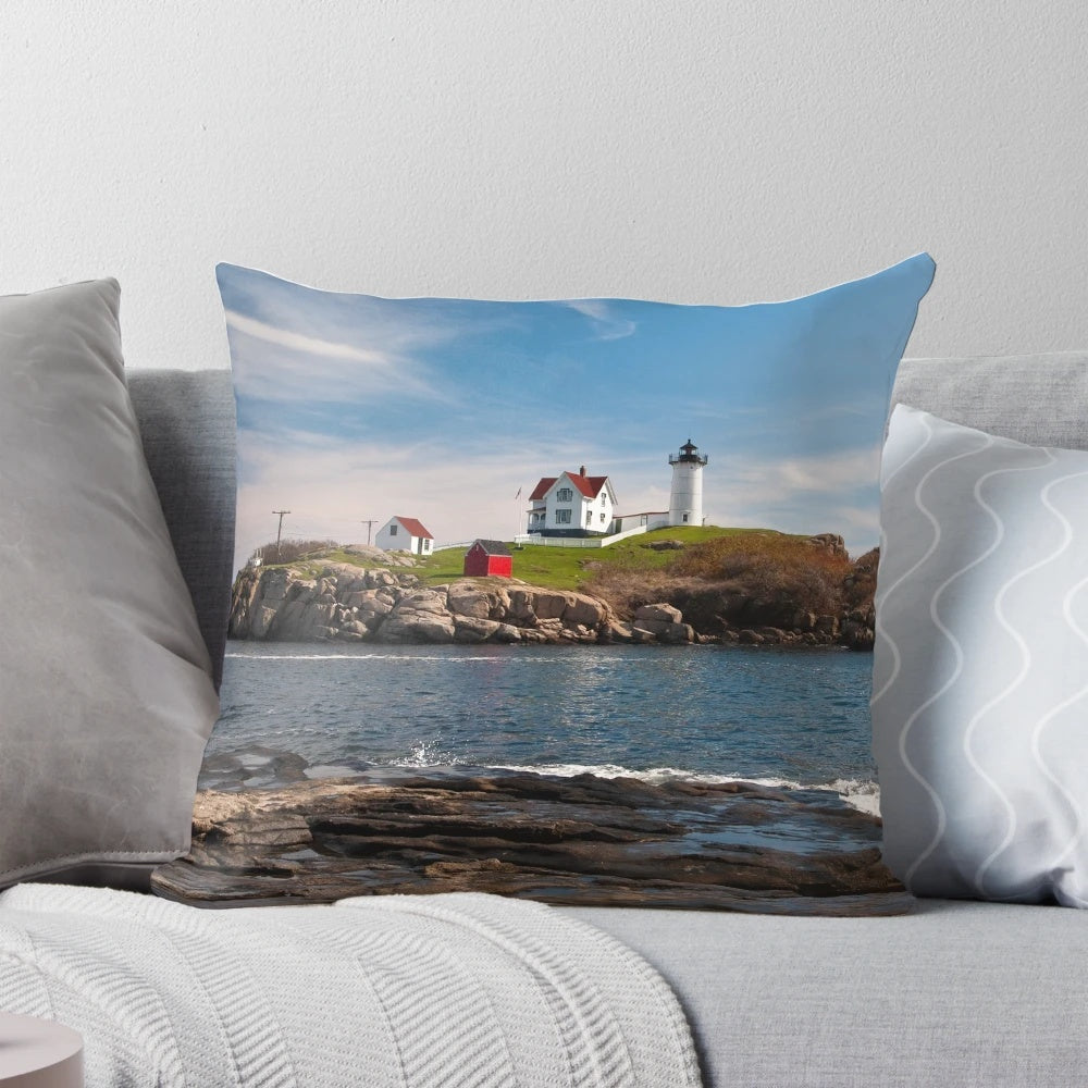 Nubble Light Coastal Pillow showcasing a picturesque Maine lighthouse by the Atlantic Ocean