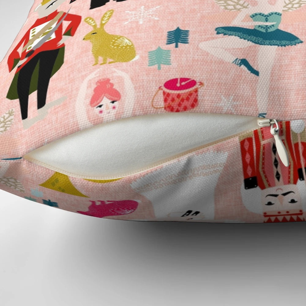 Blush-colored Nutcracker ballet-themed pillow with dance and classical music motifs
