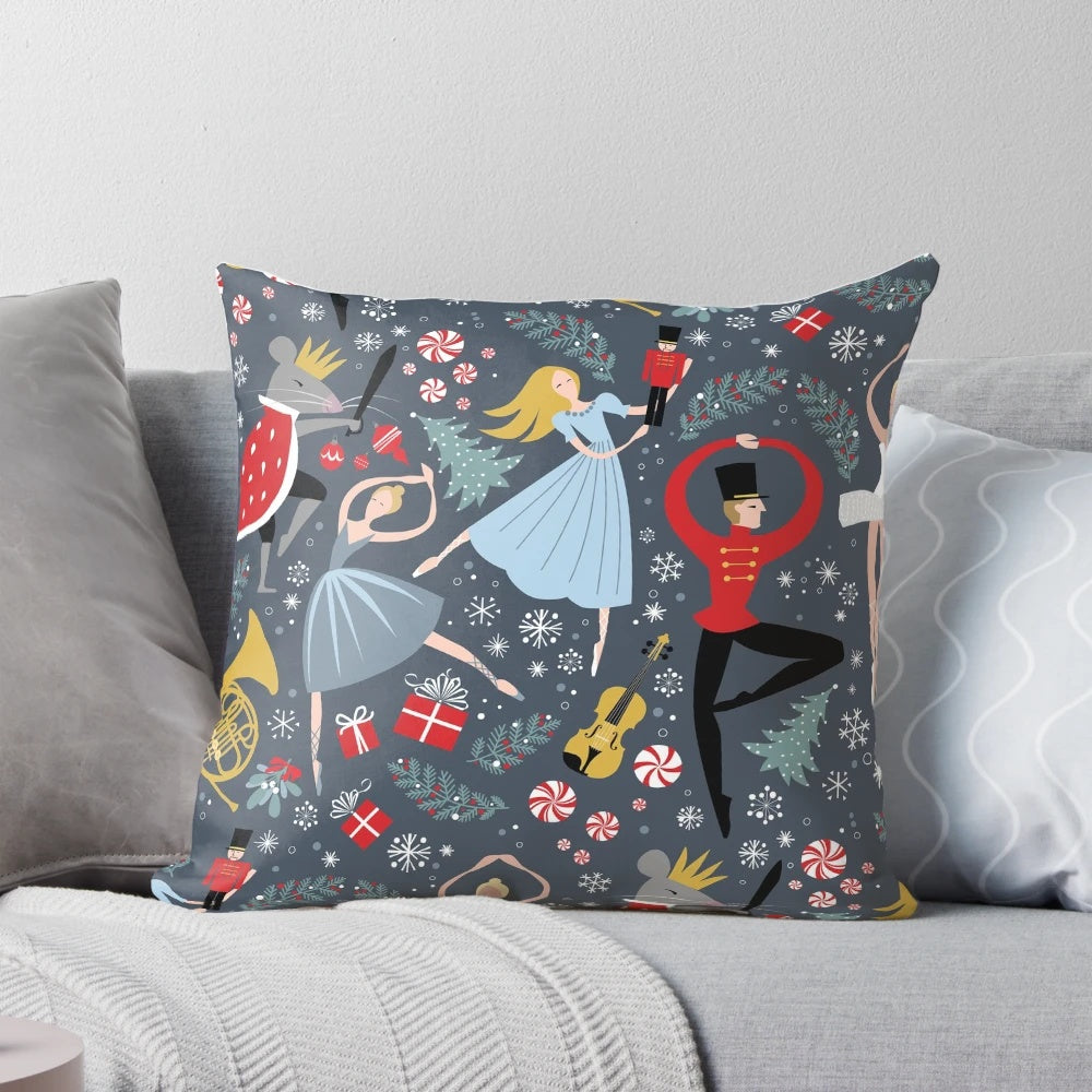 A Pillow featuring a Nutcracker Ballet design by Robin Pickens, showcasing dancers and the iconic Clara character.