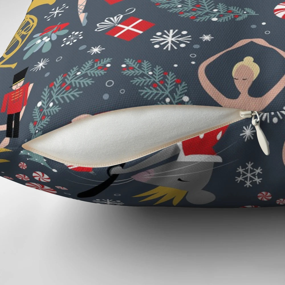 A Pillow featuring a Nutcracker Ballet design by Robin Pickens, showcasing dancers and the iconic Clara character.
