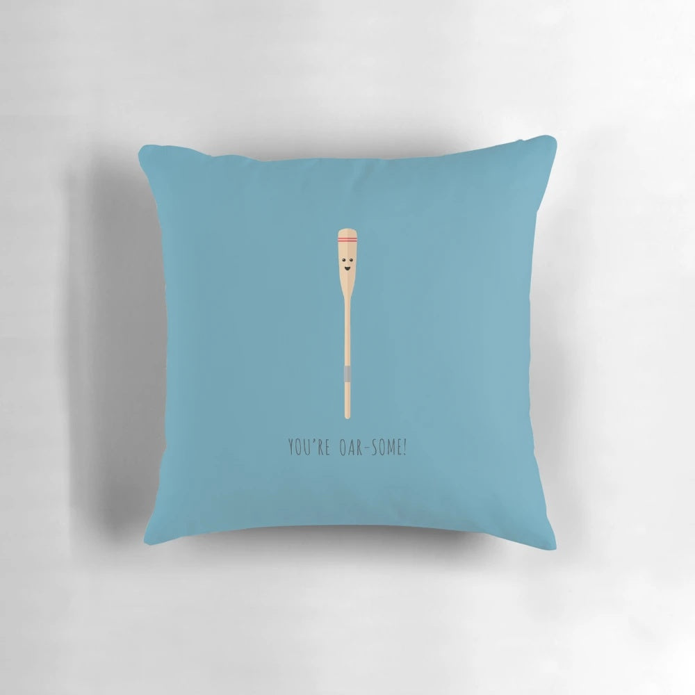 A white, square pillow with the text "Oar-some!" printed on it in a fun, whimsical font.