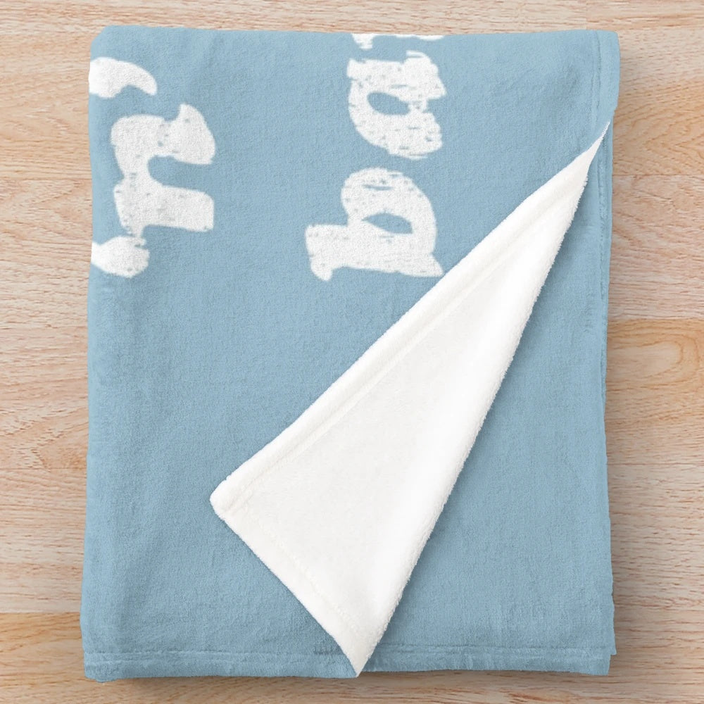 White plush blanket with Oasis lyrics