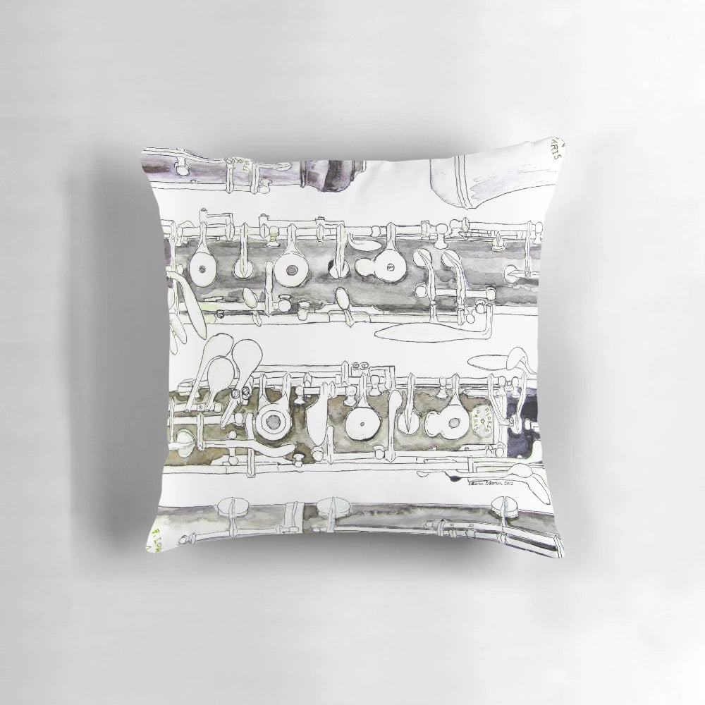 Soft, plush pillow in the shape of an oboe, a popular woodwind instrument used in orchestras and bands.