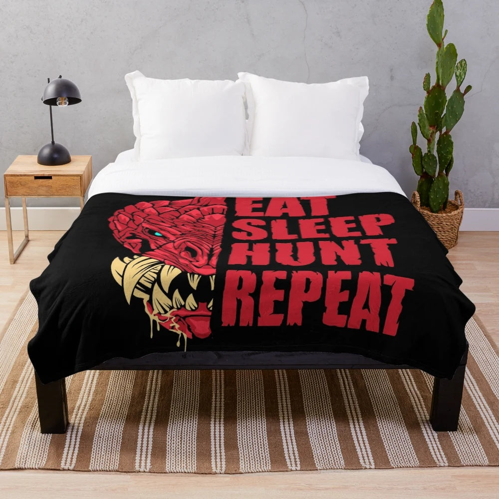 Odogaron inspired plush blanket featuring the "Eat Sleep Hunt Repeat" design