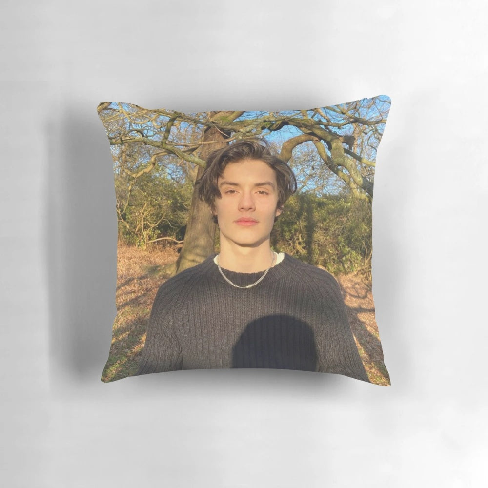 Soft, plush pillow featuring the image of British actor Louis Partridge