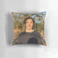 Soft, plush pillow featuring the image of British actor Louis Partridge