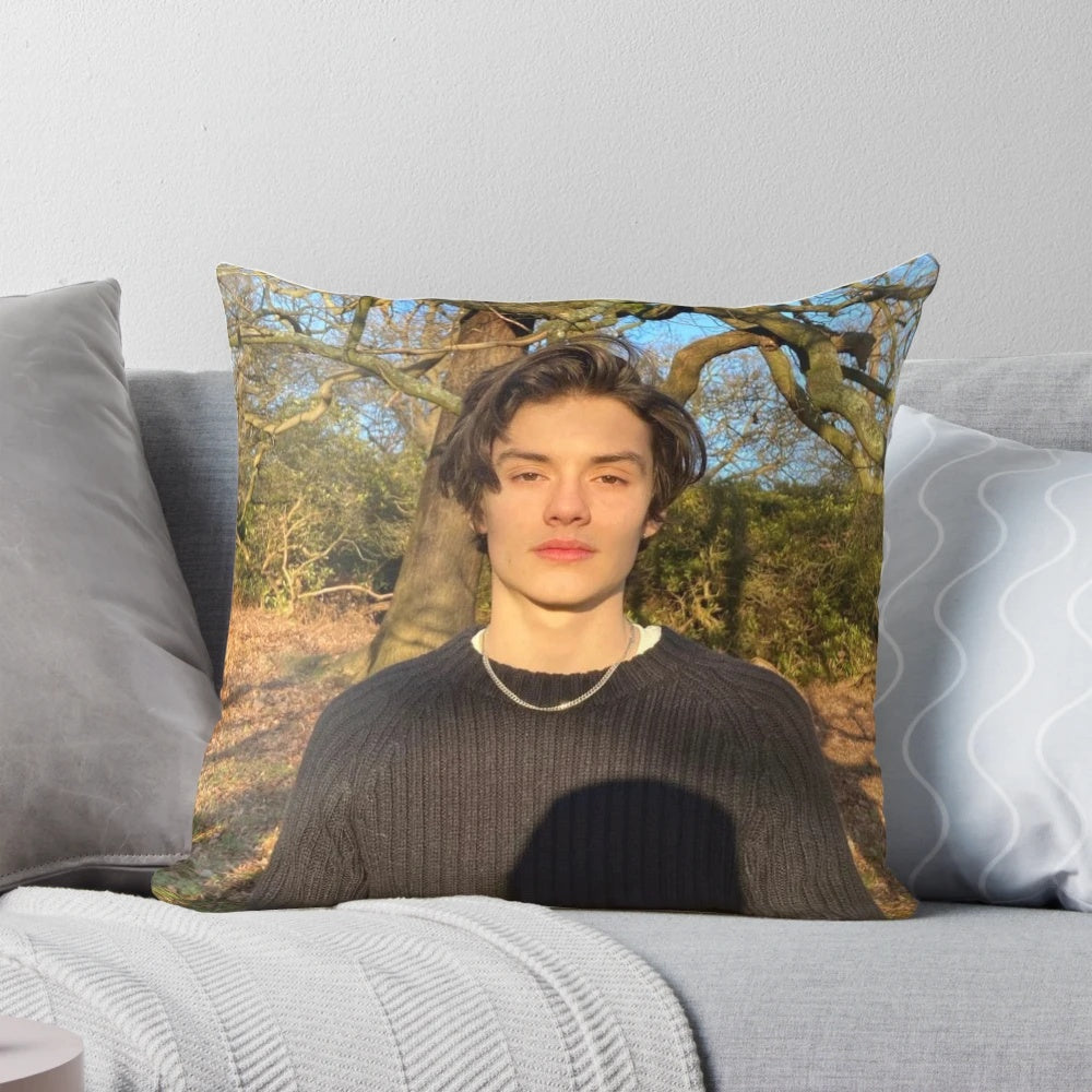 Soft, plush pillow featuring the image of British actor Louis Partridge
