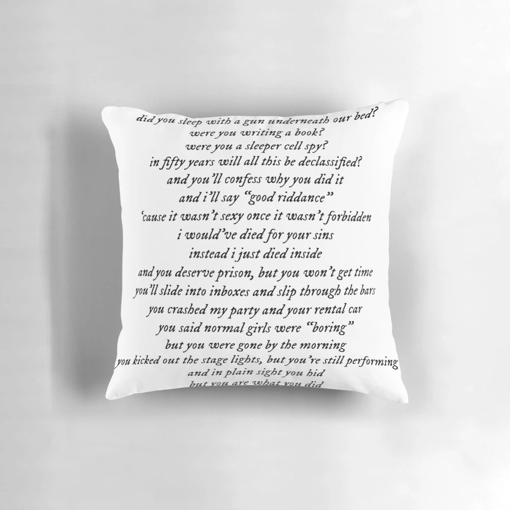 A plush pillow featuring the lyrics "the smallest man who ever lived" from Taylor Swift's songs.
